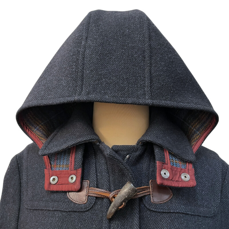 Faconnable Hooded Coat<br />
100% Wool<br />
Faux Horn Toggles<br />
Plaid Detail on Hood<br />
Color: Navy<br />
Size: XS